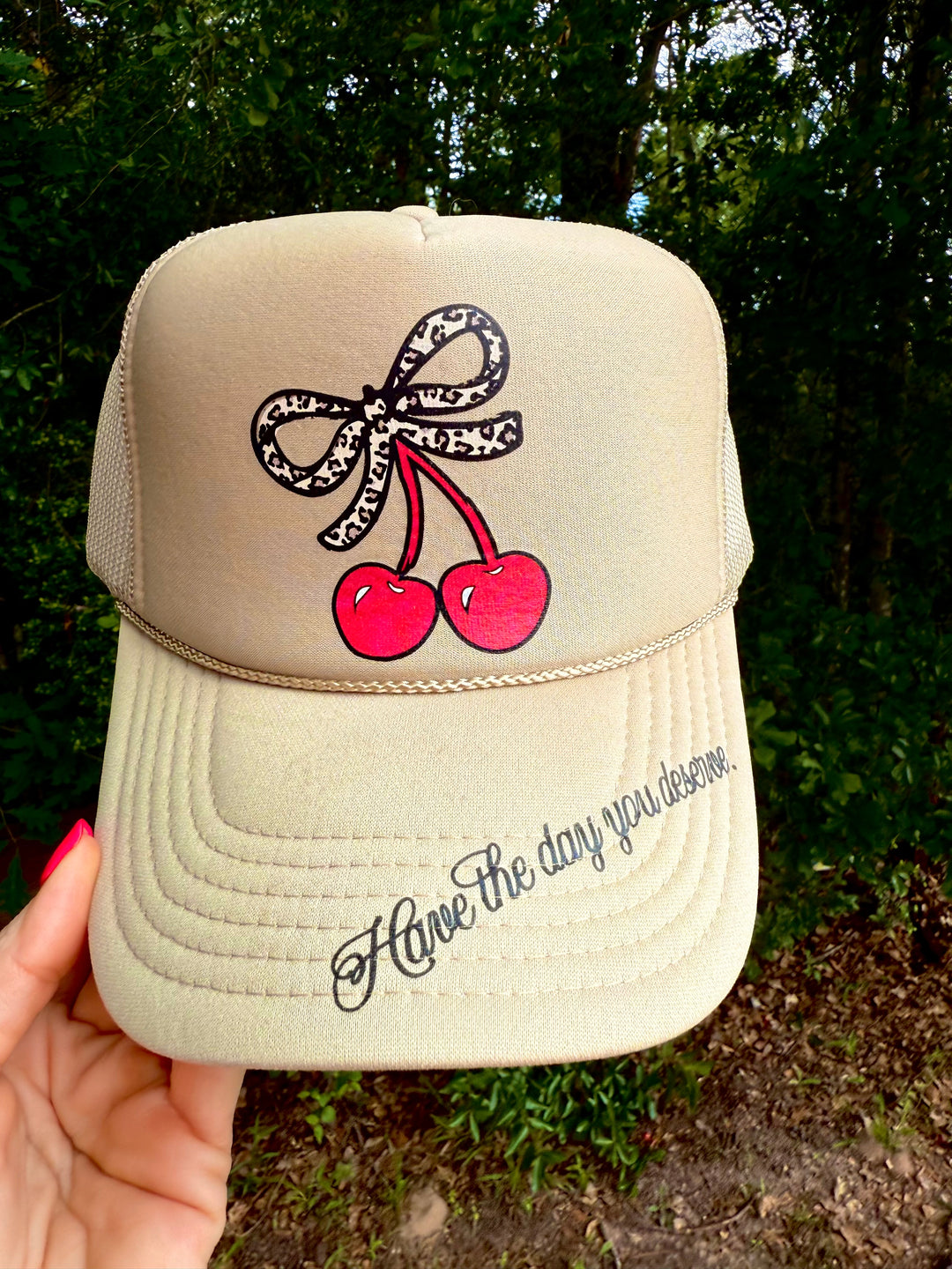 Have the day you deserve Trucker Hat